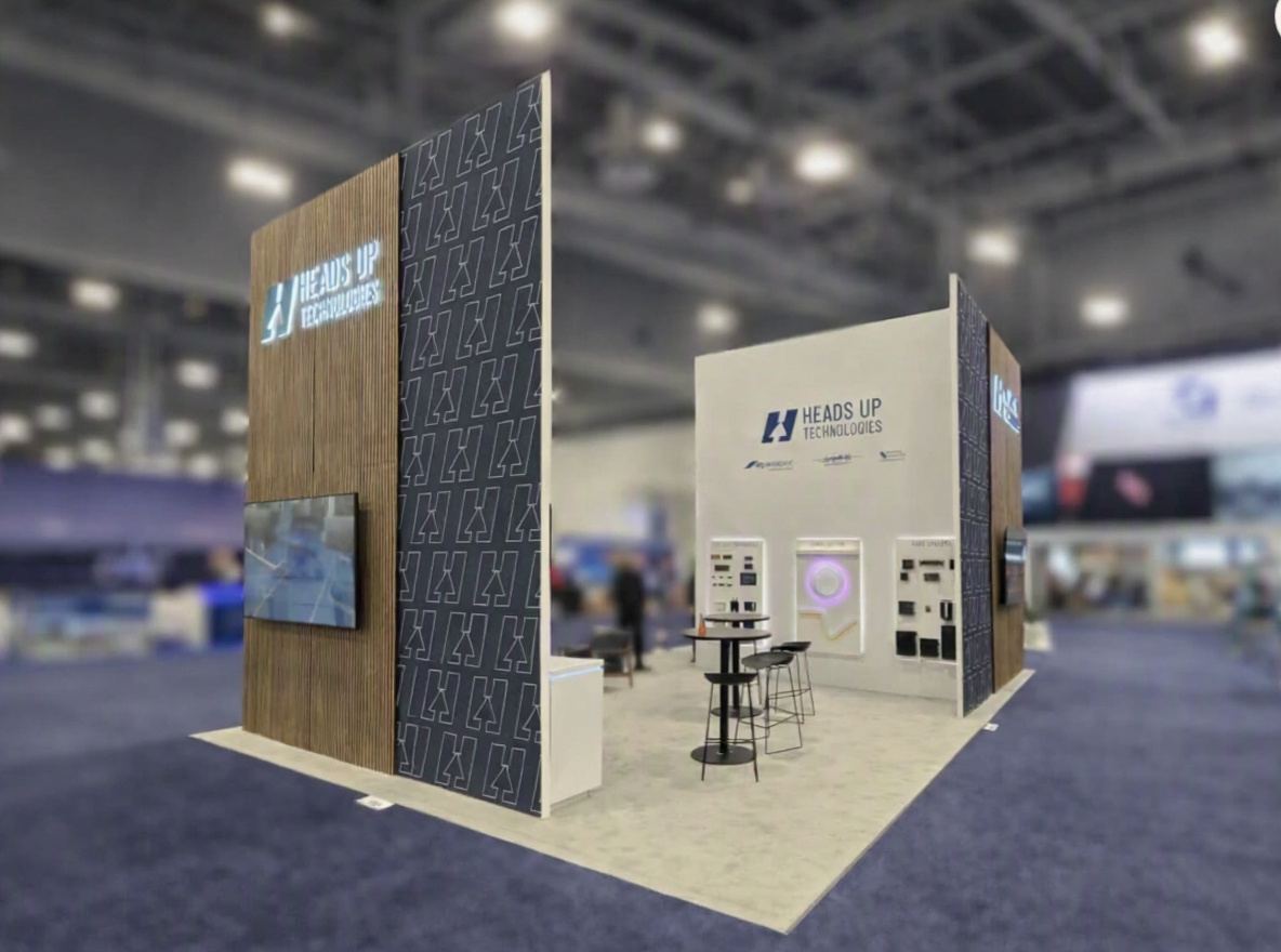 Heads Up Technologies exhibit with custom wood-slat tower